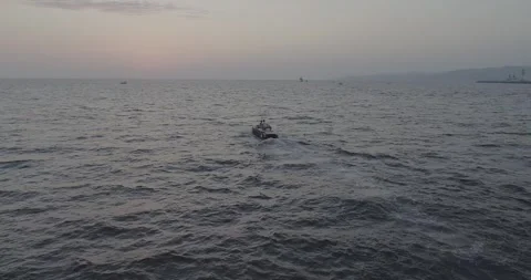 Tracking Drone Shot Around Couple Sailing at Sunset in Sochi, Russia Stock-Footage 344008220
