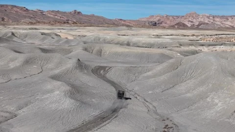 Tracking Drone Shot of ATV Vehicle Moving in Desert Landscape of Utah USA on Stock Footage 346105583