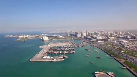 Tracking drone shot over Doha marina and museum of islamic arts Qatar Stock Footage 105727006