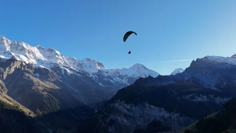 Tracking drone shot of Paragliding in Murren Switzerland, with breathtaking Stockbeeldmateriaal 296585516