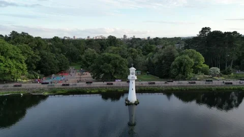 Tracking drone shot of Roath Park Lake in Cardiff South Wales Stock Footage 248626935