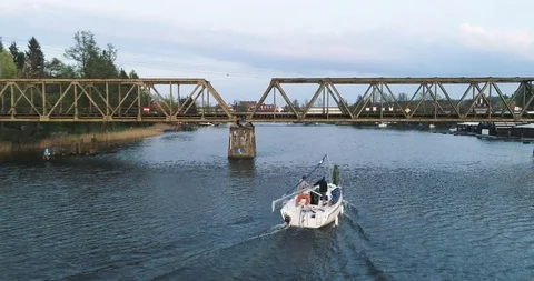 Tracking drone shot of sailboat under the bridge 스톡 동영상 89416067