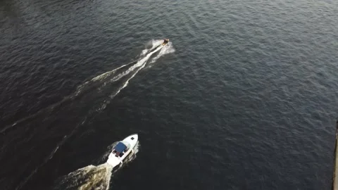 Tracking drone shot of ships in Malaya Nevka river Stockbeeldmateriaal 248872406