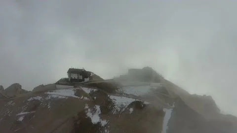 Tracking drone video showing low level clouds covering the Dolomites, Italy Stock Footage 234108441