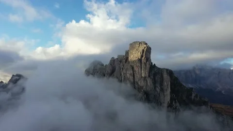 Tracking drone video showing low level clouds covering the Dolomites, Italy Stock Footage 234112594