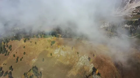 Tracking drone video showing low level clouds covering the Dolomites, Italy Stock Footage 234113449
