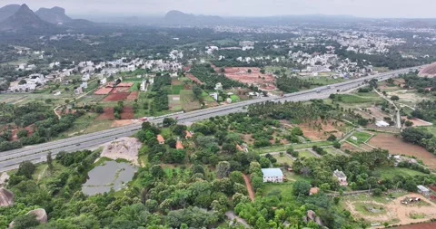 A tracking drone view of the Mysore to Bangalore old highway road near Rama.. Video stock 319387500