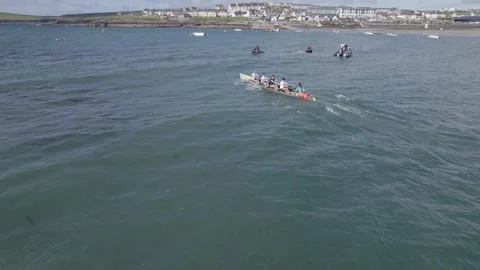 Tracking Drone View of Rowing Team in Boat During Competition in Kilkee, County Stock Footage 346412885