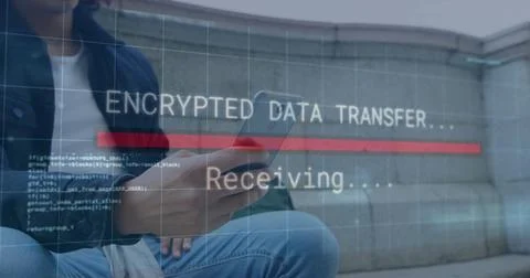 Tracking encrypted data transfer on smartphone by man sitting on ledge in plaza, 写真素材