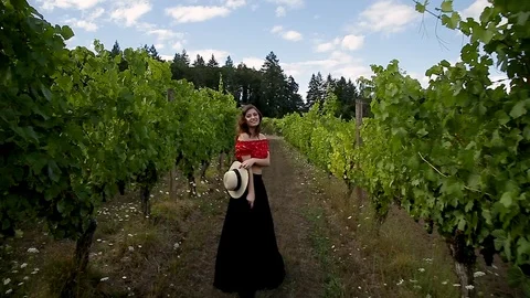 Tracking gimbal shot of an attractive young brunette woman in a cute summer 스톡 동영상 115288092