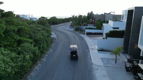 Tracking Golf cart Mexico Stock Footage 247388207