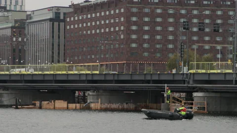 Tracking gray inflatable rib boat during water train track construction Stock Footage 143264793