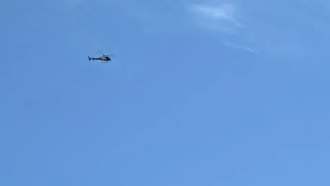 Tracking With Helicopter As It Flys Through The Sky Video stock 131600753
