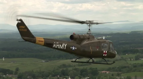 Tracking a Huey Medivac helicopter while in the air Stock Footage 41240354