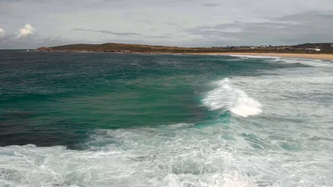 Tracking a huge wave moving towards a beach, Sydney, Australia, 4K Stock Footage 105602442