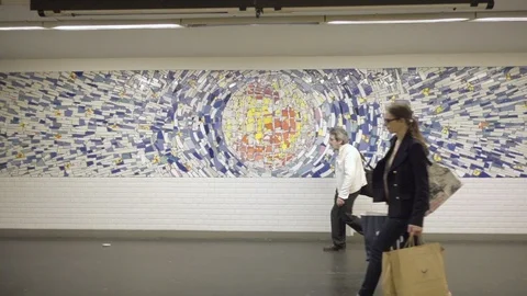 Tracking inside metro - tile mural on wall - public transportation Paris France Stock Footage 94373503