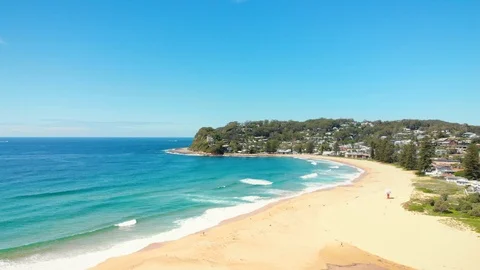 Tracking left over beautiful Avoca Beach, Australia Stock Footage 126366452