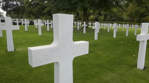 Tracking left to right along graves in the American War Cemetery, Cambridge. Stock Footage 97490232
