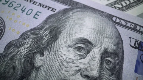 Tracking macro of Benjamine Franklin's face on the US one hundreed dollar bill Video stock 107608885