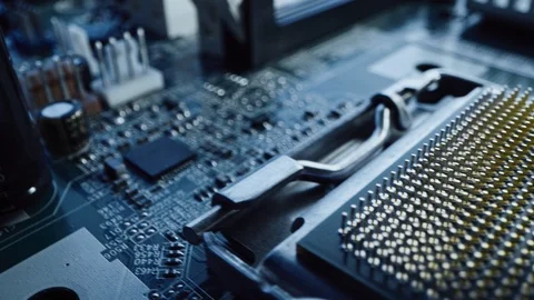 Tracking Macro Camera Shot: Focus on a CPU Processor Socket. Printed Board Stock Footage 120930230