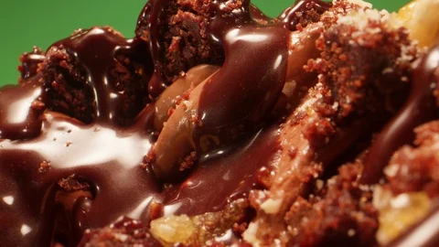 Tracking Macro Shot of Freshly Made Chocolate Browny Ice Cream Green Box Stock Footage 128965177