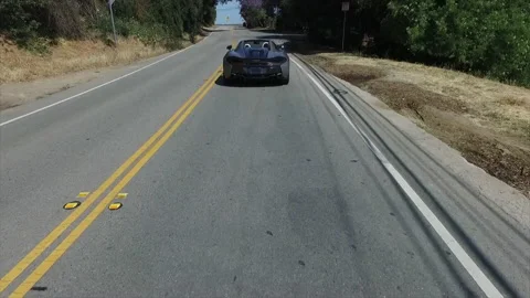 Tracking McLaren speeding Stock Footage 132471755
