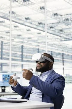 Tracking microchip defects data, VR goggles gear and technician Stock Photos