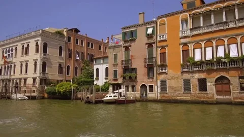 Tracking moving shot along the Grand Canal and  Chisea San Germa showing Vene Stock Footage 83318822