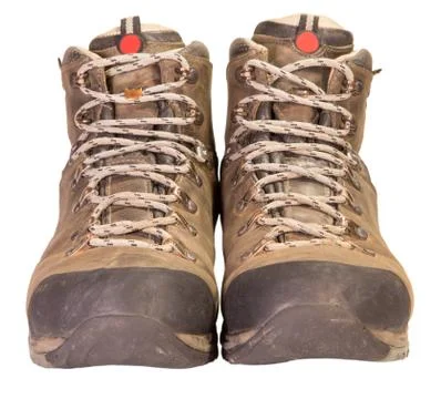 Tracking the old brown leather boots. Stock Photos