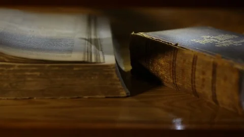 Tracking By Old Large Closed Bible And Other Old Books Stock-Footage 102153170