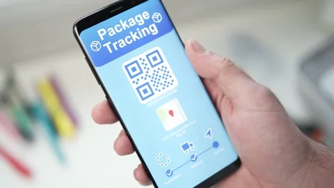 Tracking a Package on a Mobile Smart Phone App with QR Code Video stock 165938296