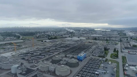 A Tracking, Pan Shot of a Large Waste Water Treatment Plant Stock Footage 89851094