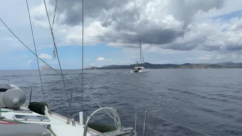 Tracking a Passing Catamaran from Sailboat Stock Footage 311060215