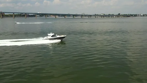 Tracking profiling view of speed boat slight ascend 스톡 동영상 114544863