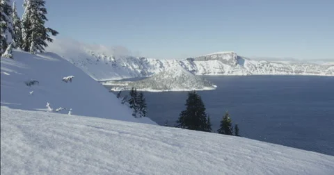 Tracking Red Camera Through Winter Crater Lake Landscape, Red Dragon Camera Vídeo Stock 59681501