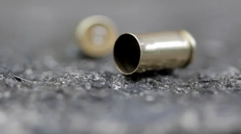 Tracking up to reveal bullet shells Stock Footage 23544776