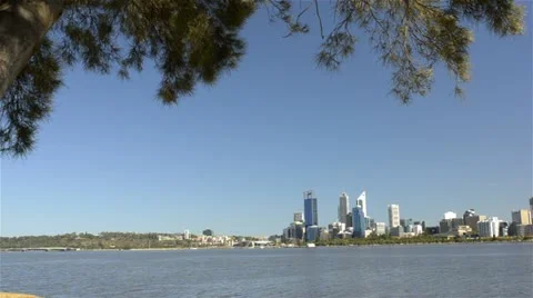 Tracking reveal of Perth City across the Swan River Stock Footage