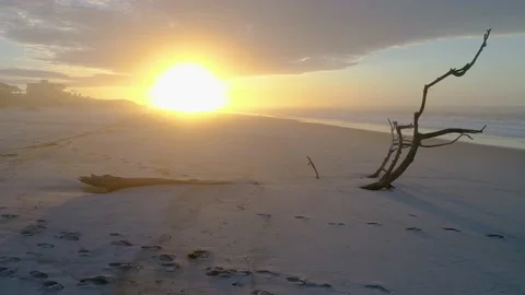 Tracking right on gorgeous sunrise on private beach Stock Footage 155460125