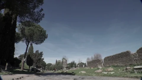 Tracking from right to left of an ancient Roman road, Via Appia Stock Footage 73985473