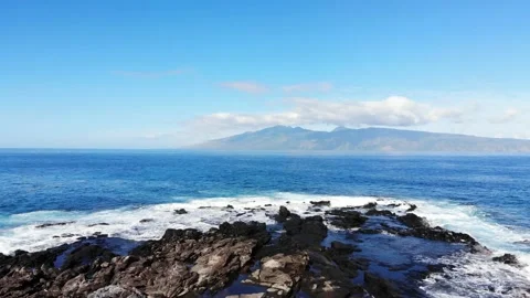 Tracking right on rocks off the coast of Maui Stock Footage 155458061