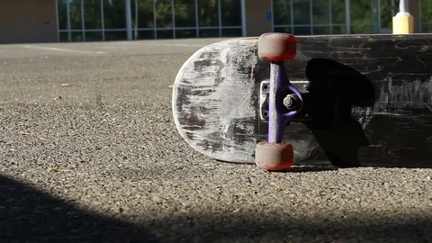 Tracking Right Skateboard on its Side in Parking Lot Extreme Sports Dolly Sho Stock Footage 114034654