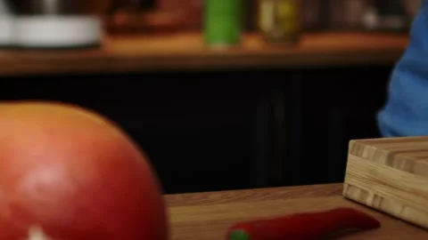Tracking right video of slicing leek in the kitchen Stock Footage 131589069