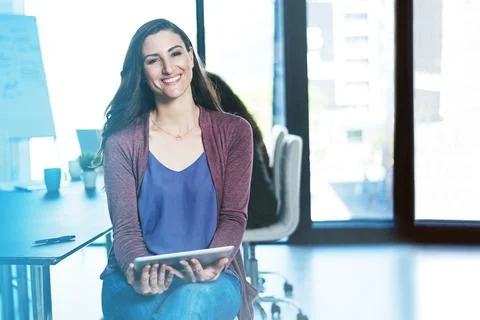 Tracking sales has never been this easy. a businesswoman using a digital tablet Stock Photos
