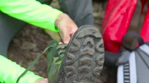 Tracking shoes into human hands Stock Footage 49058605
