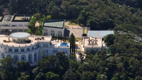 Tracking Shot Across Curved Neoclassical Facade Of Luxury Mansion In Forest Vídeo Stock 342652526