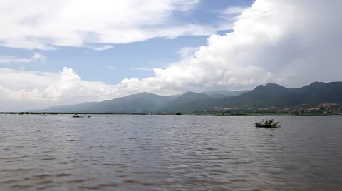 Tracking Shot Across Water With Mountains In Background Stock Footage 62537448