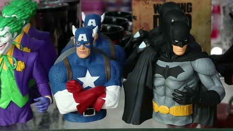 Tracking Shot of Action Hero Figurines in Souvenir Shop Stock Footage 71291554