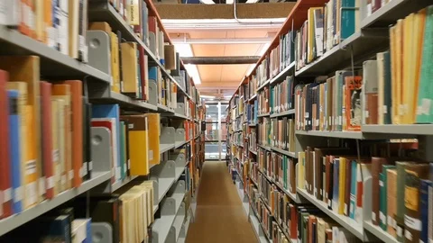 Tracking shot of an aisle at a library Stock Footage 105803140