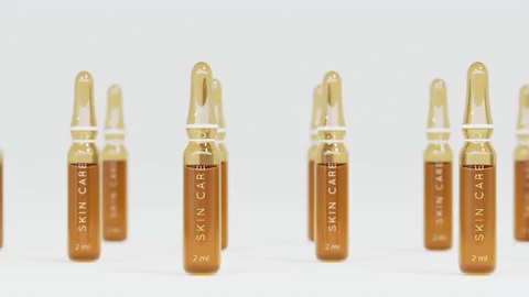 Tracking shot of ampoules on white background with shallow dof. Hyaluronic acid Stock Footage 157418475