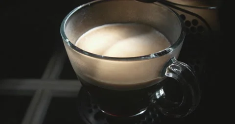 Tracking shot in arc cup of coffee on coffee maker Vídeo Stock 135842151